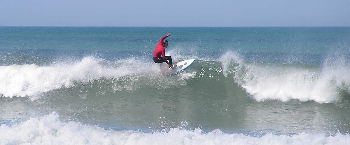 Surfer enjoying the surf at Bude