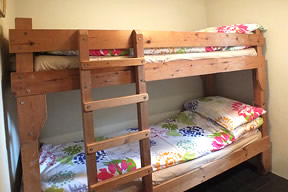 Bunk bedroom (bunk beds full length but not full width)